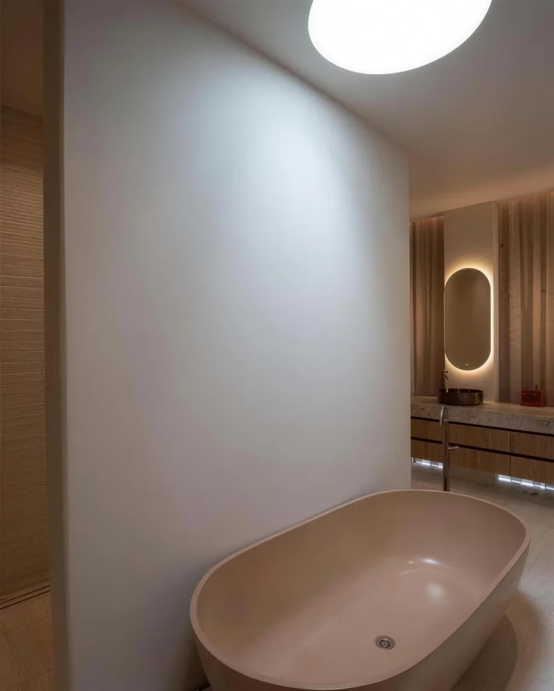 Bathroom with micro cement walls and a freestanding bath